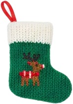 a green christmas stocking with a red bow.jpg